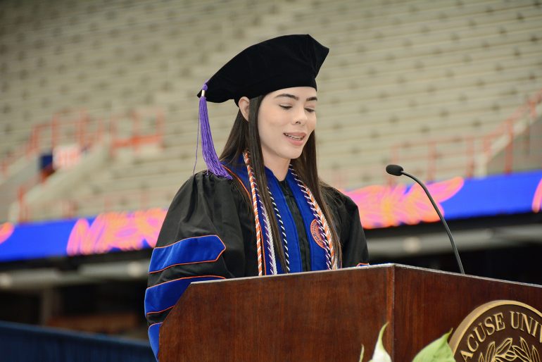 Ludmilla Evelin presents her speech at the College of Law 2023 commencement ceremony. 