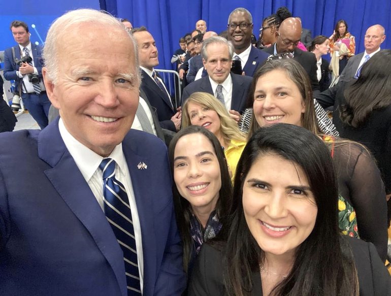 Ludmilla Evelin and her colleagues take a picture with President Joe Biden. 